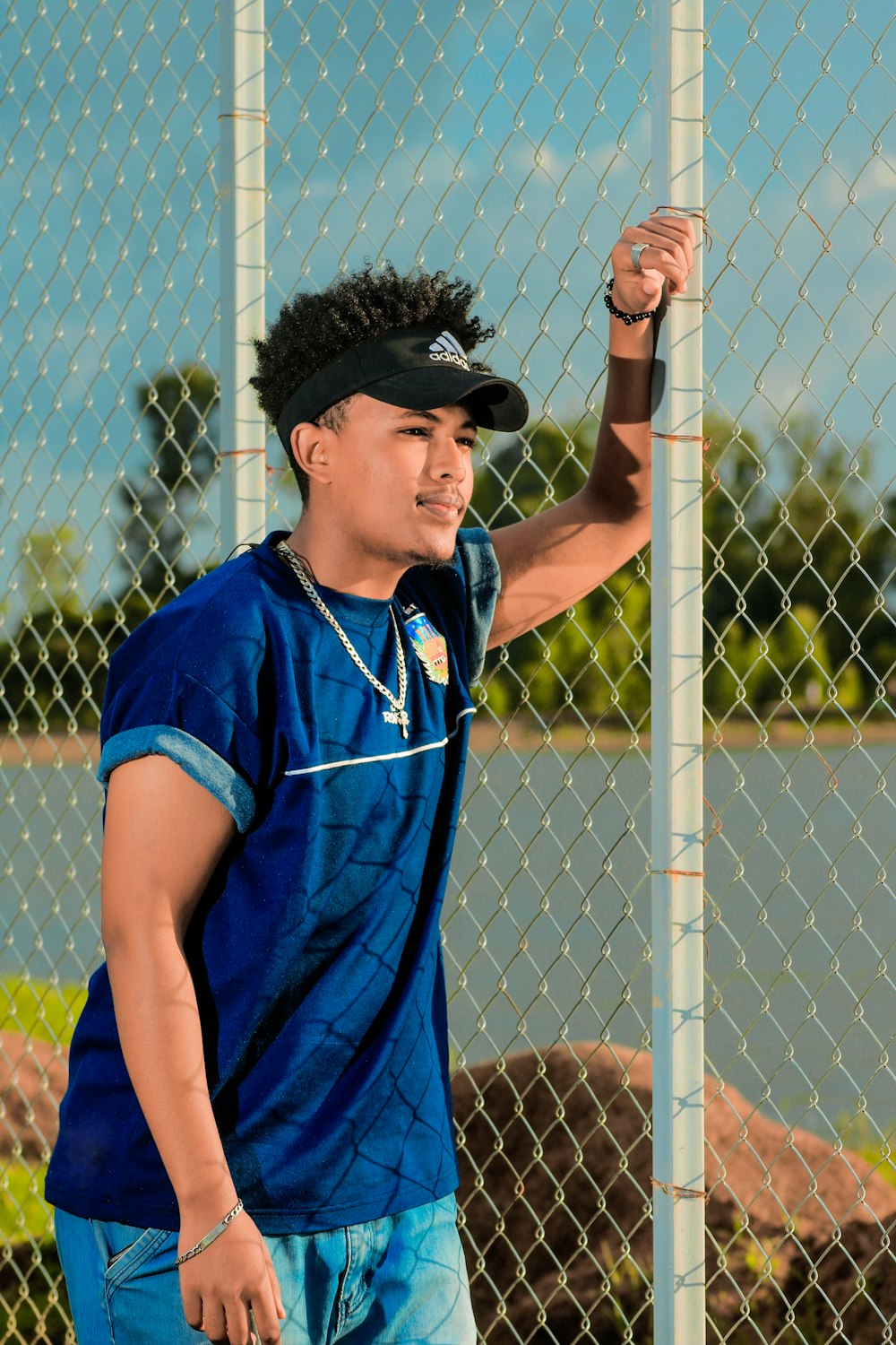 a man holding a tennis racquet on top of a tennis court