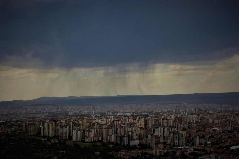 a view of a city under a cloudy sky