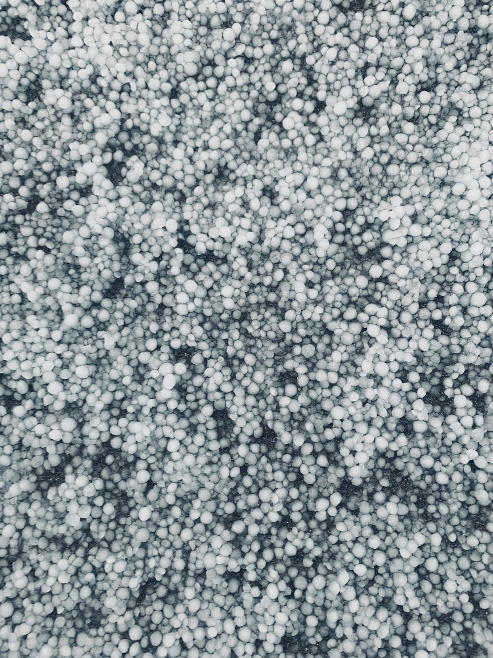 a black and white photo of a bunch of bubbles