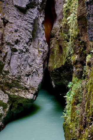 a narrow river running between two large rocks