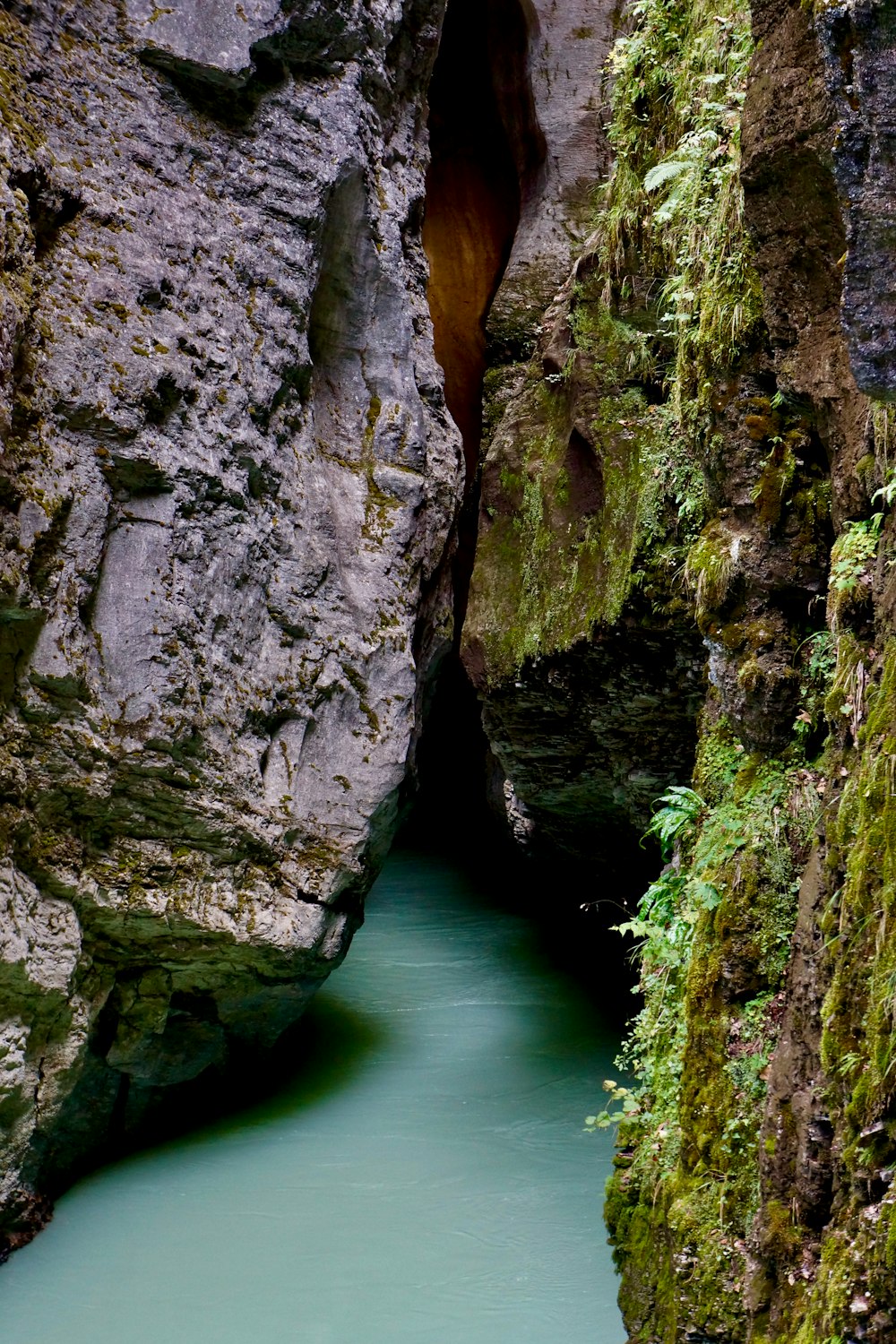 a narrow river running between two large rocks