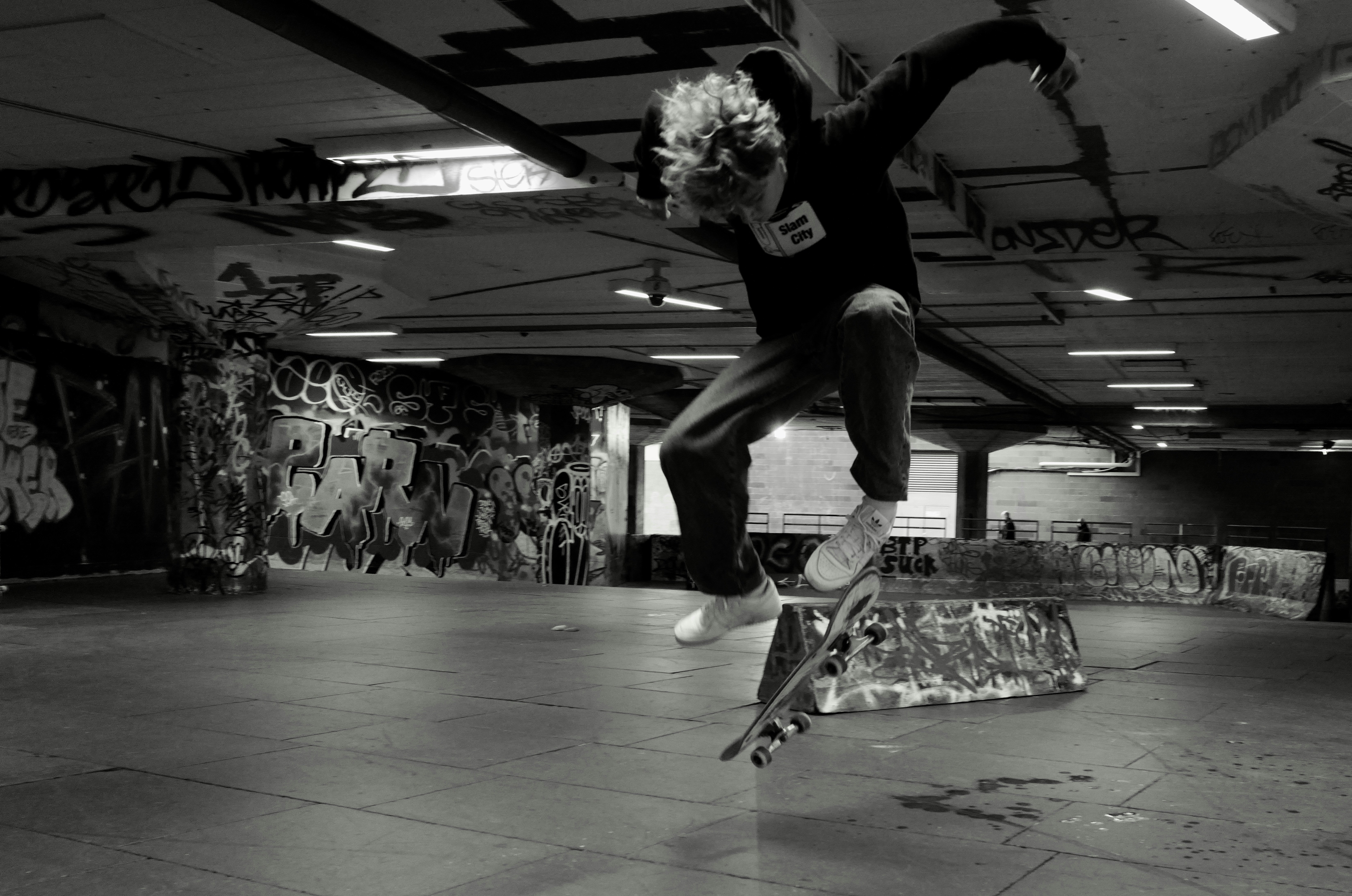 a man riding a skateboard up the side of a ramp