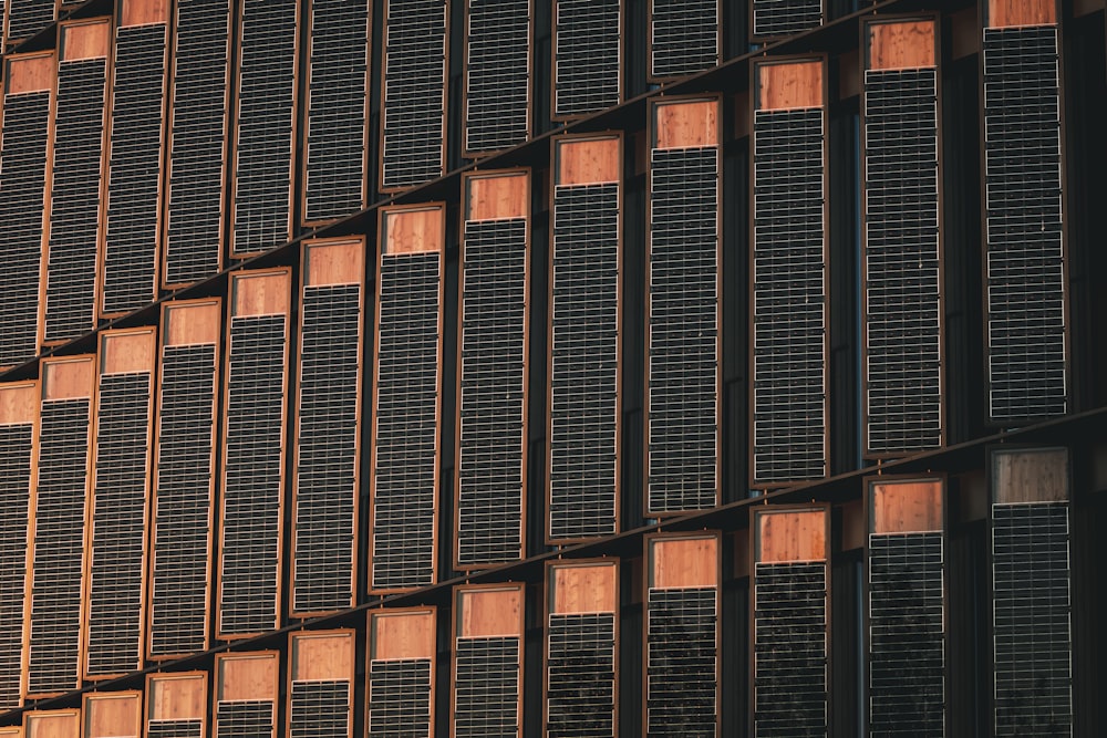 a tall building with lots of windows next to a clock