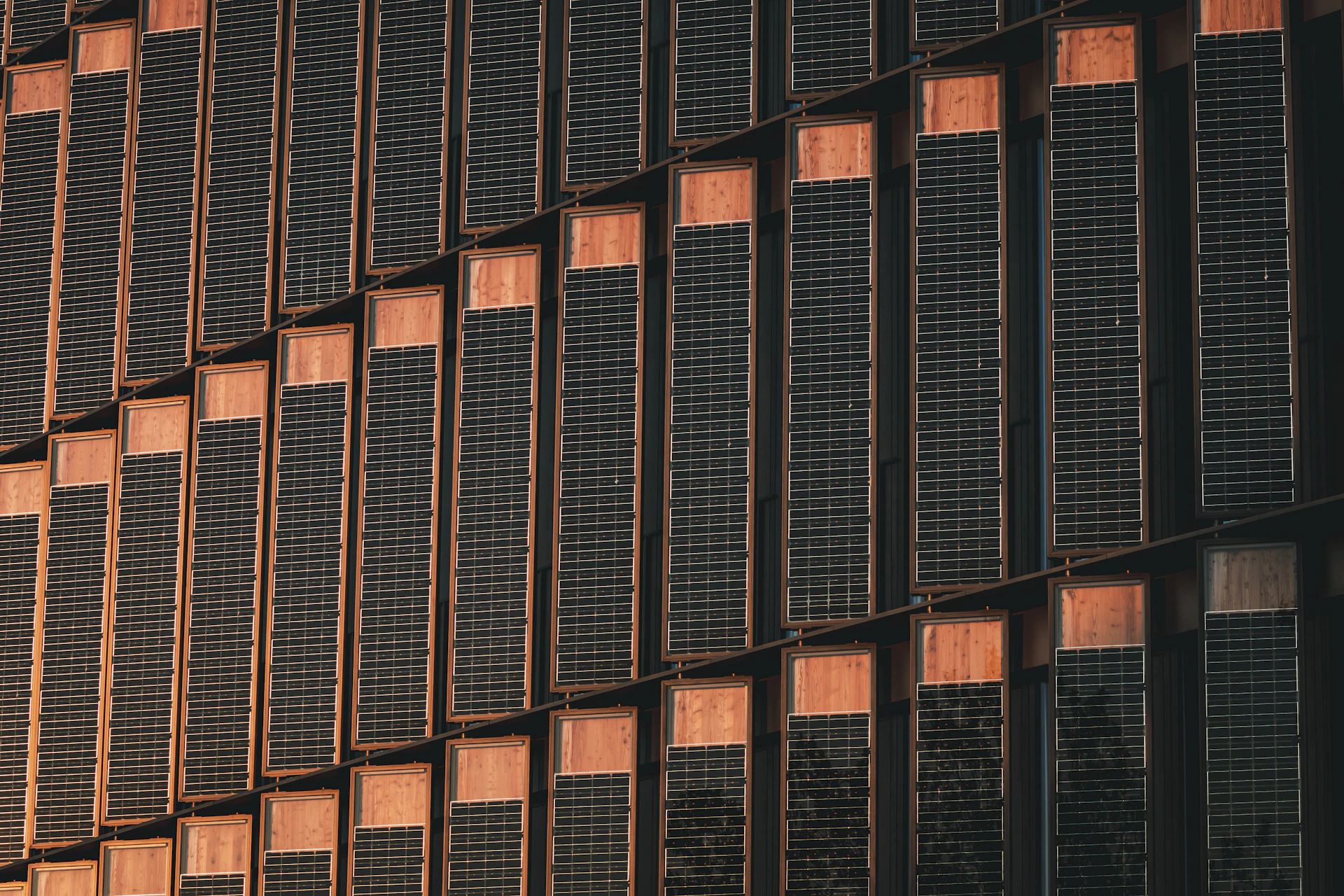 a tall building with lots of windows next to a clock