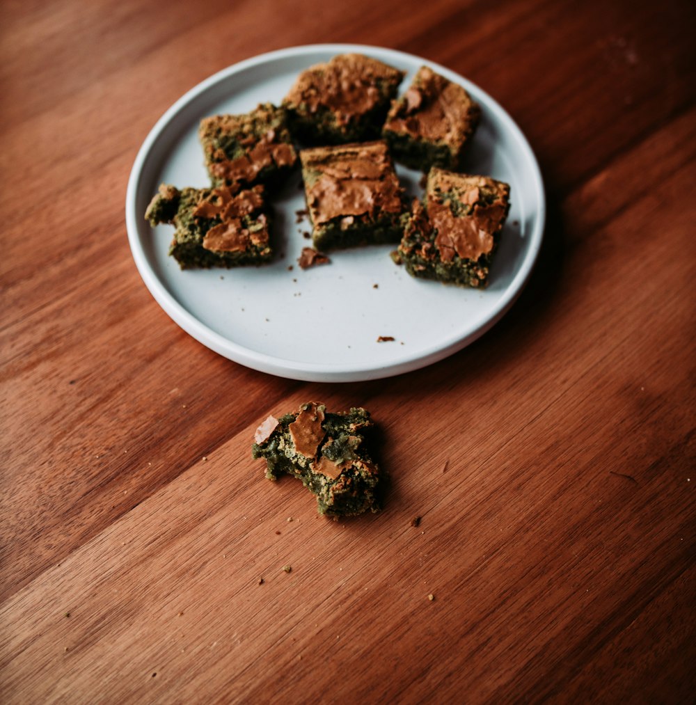 a plate of food on a wooden table