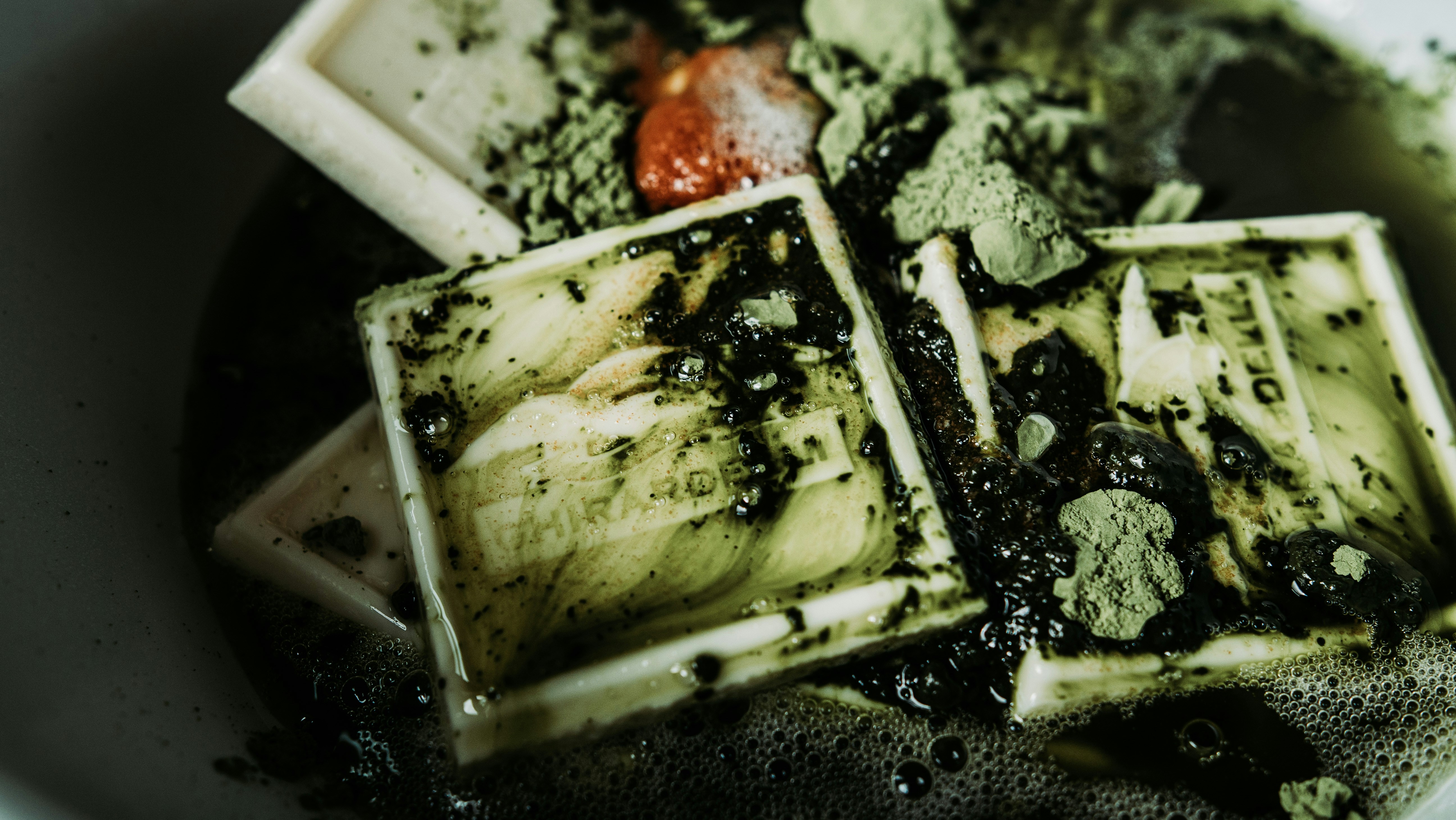 a white bowl filled with food on top of a table