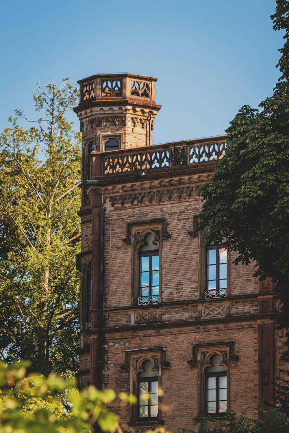 a tall brick building with a clock tower