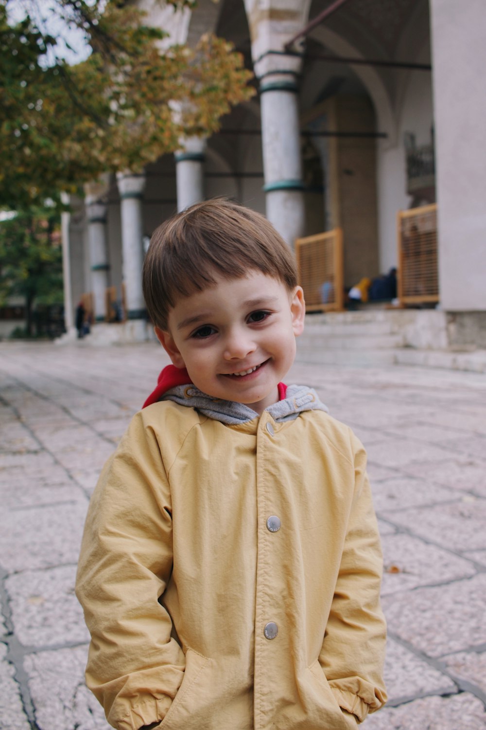 a little boy that is standing in the street