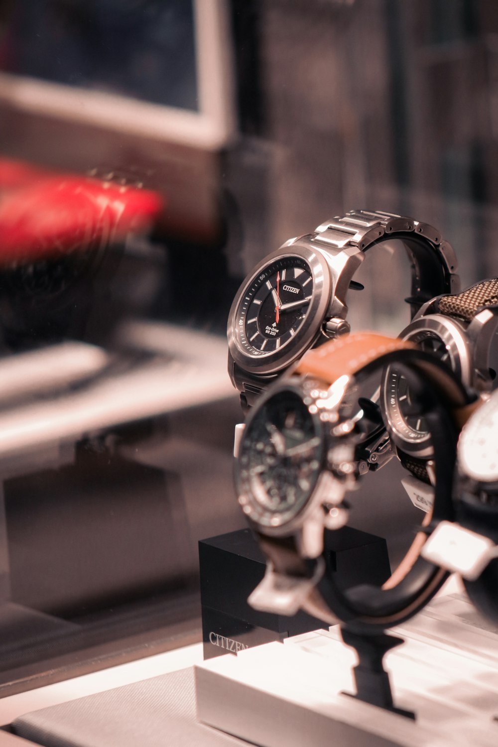 a couple of watches are on display in a glass case