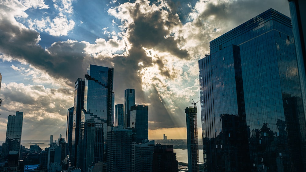 a view of a city with skyscrapers and clouds