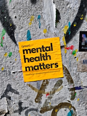 a yellow sign that reads your mental health matters