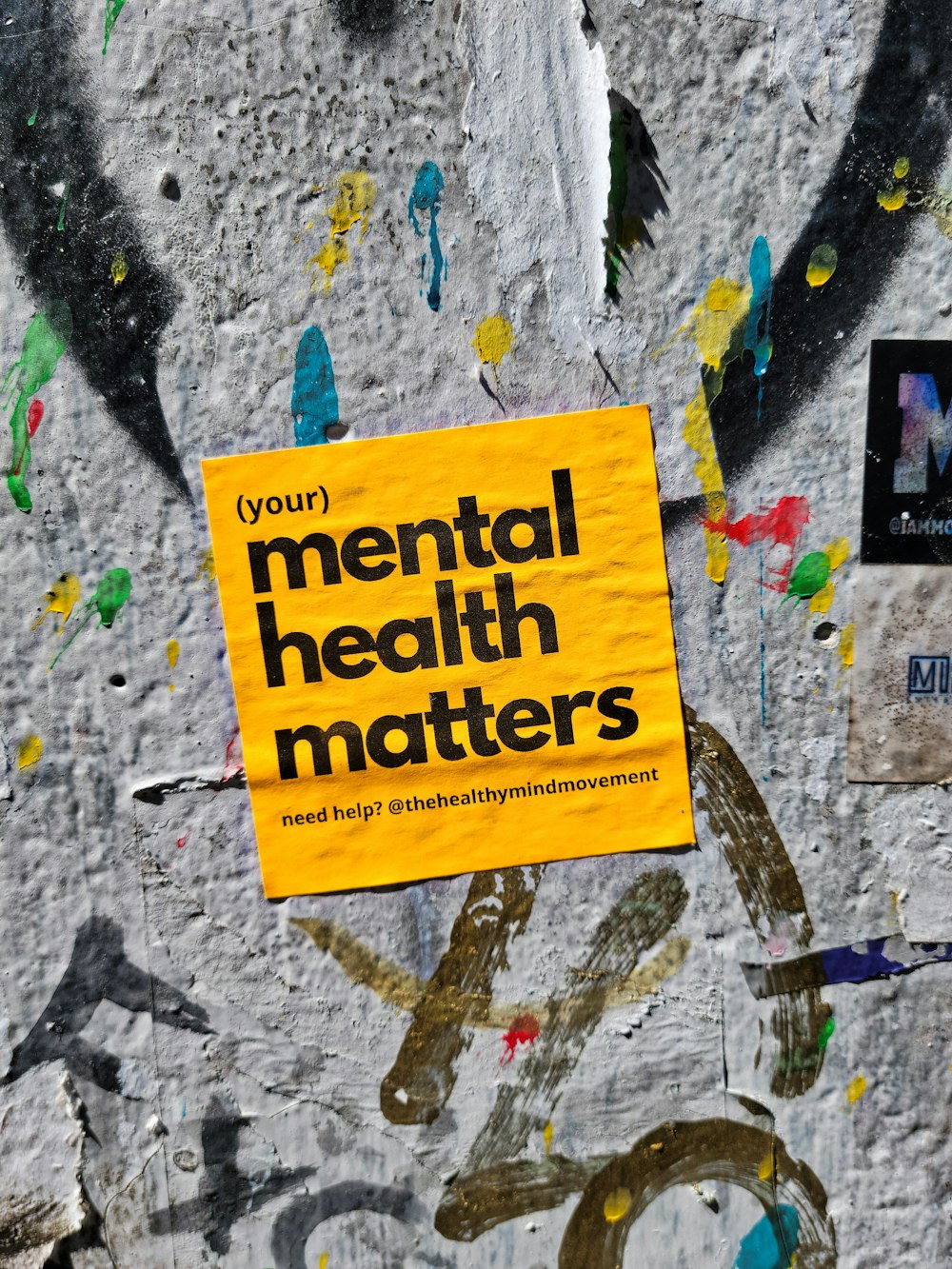 a yellow sign that reads your mental health matters