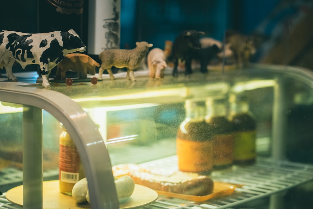 a display case filled with lots of toy animals