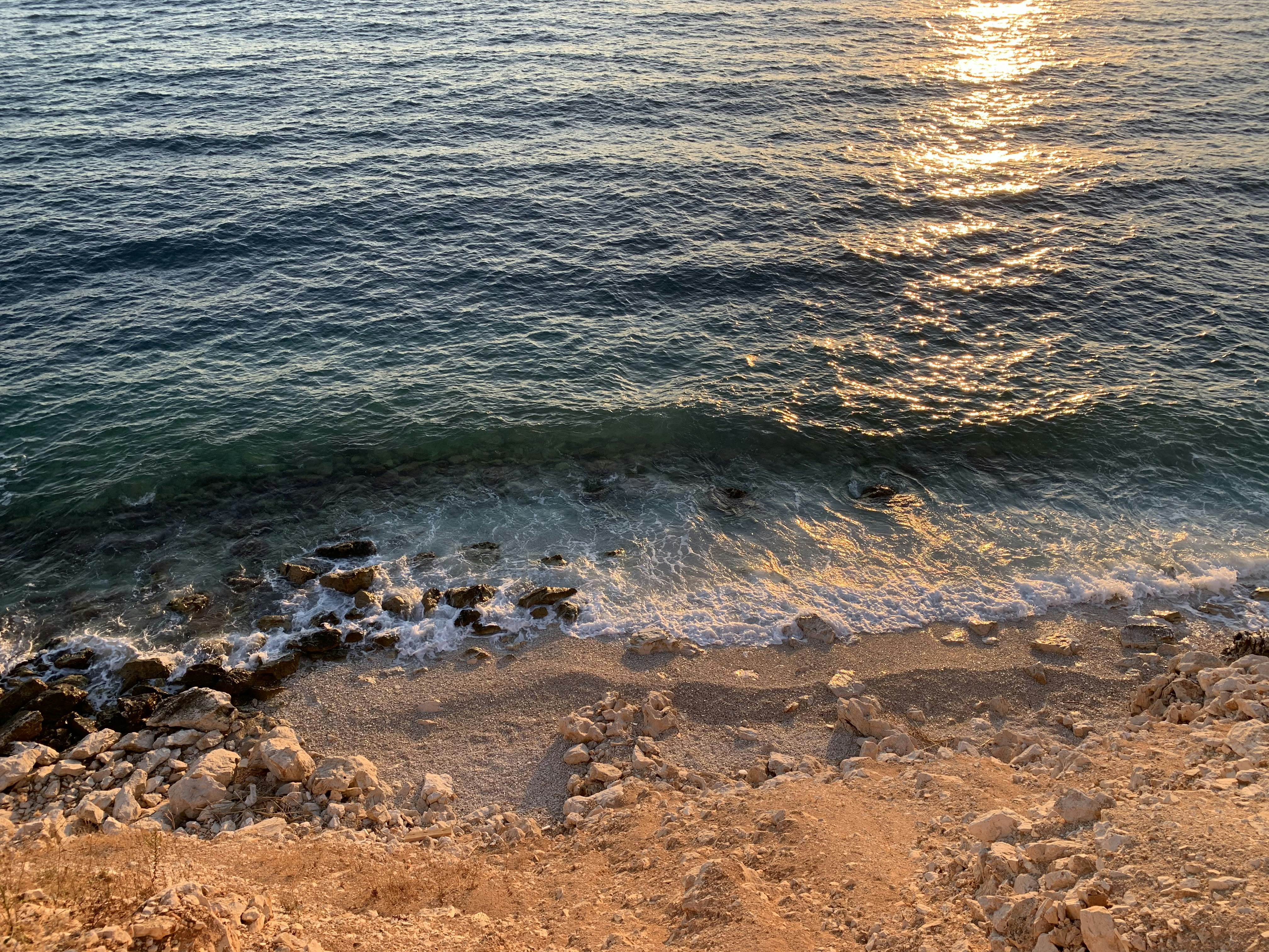 a view of a body of water from a cliff
