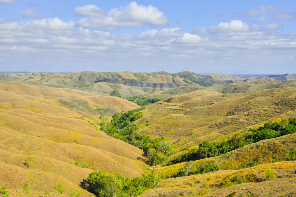 a scenic view of a valley in the mountains