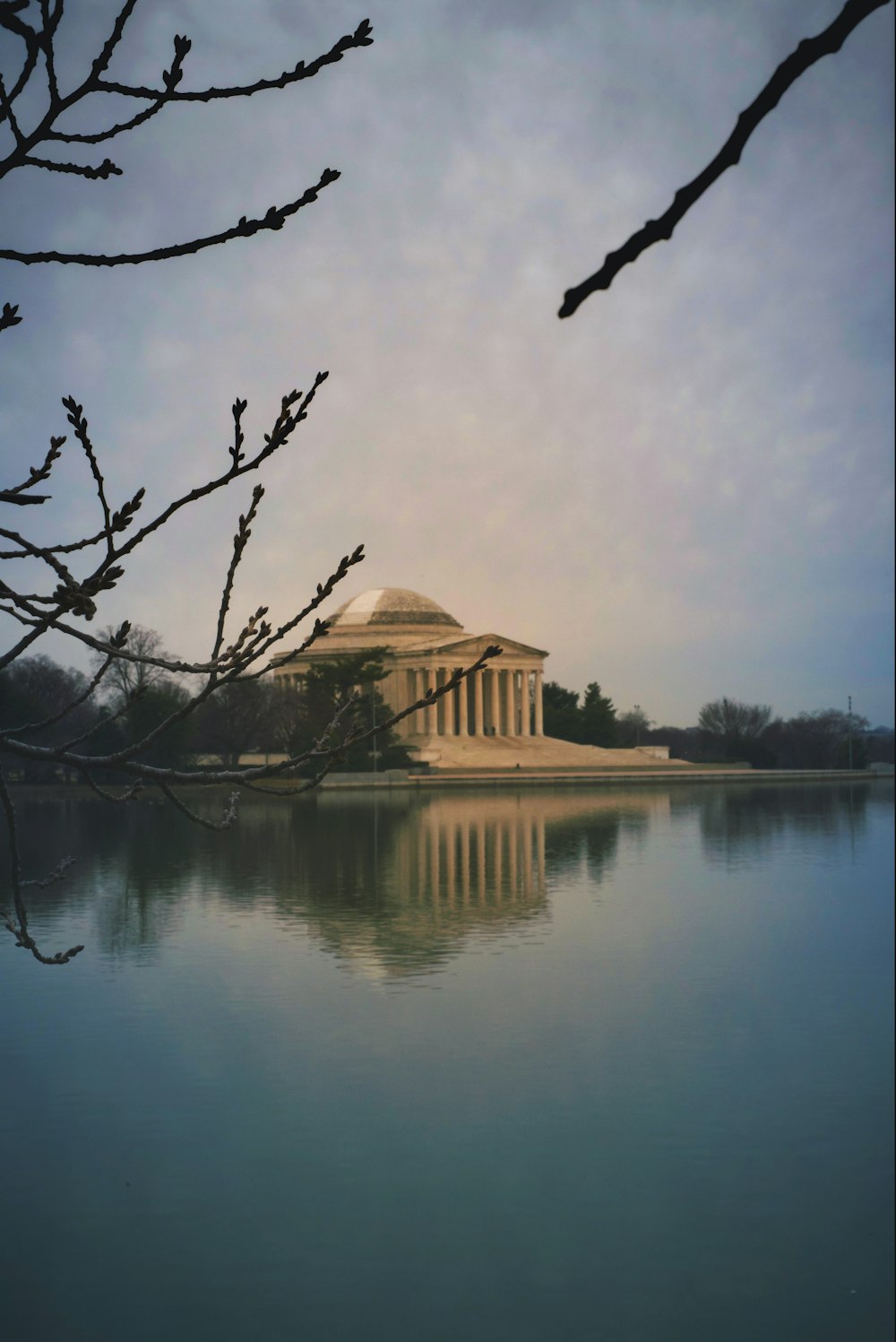 a large building sitting on top of a lake