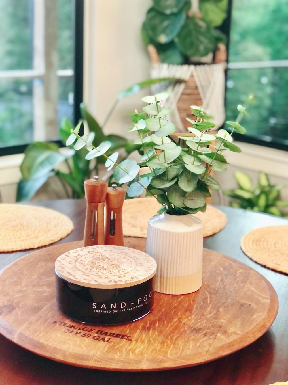 a wooden table topped with a potted plant