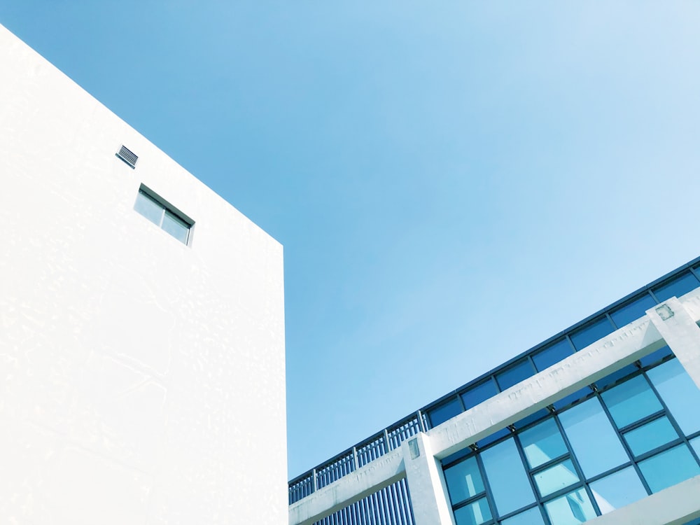 a tall white building sitting next to a tall white building