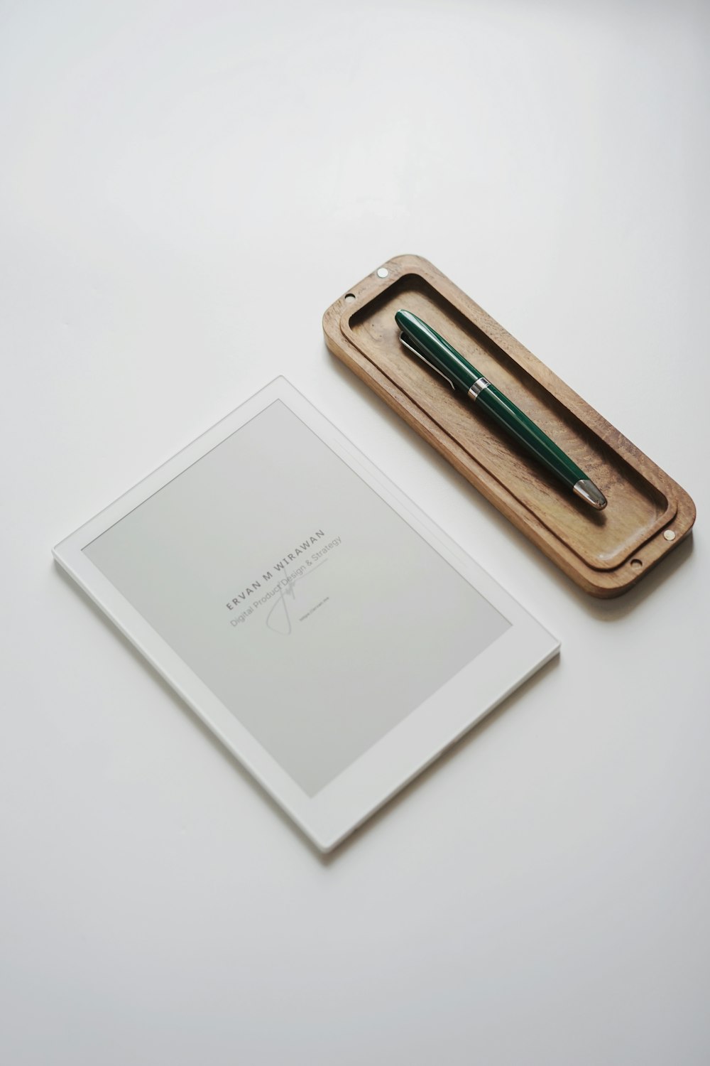 a pen and a notebook on a table