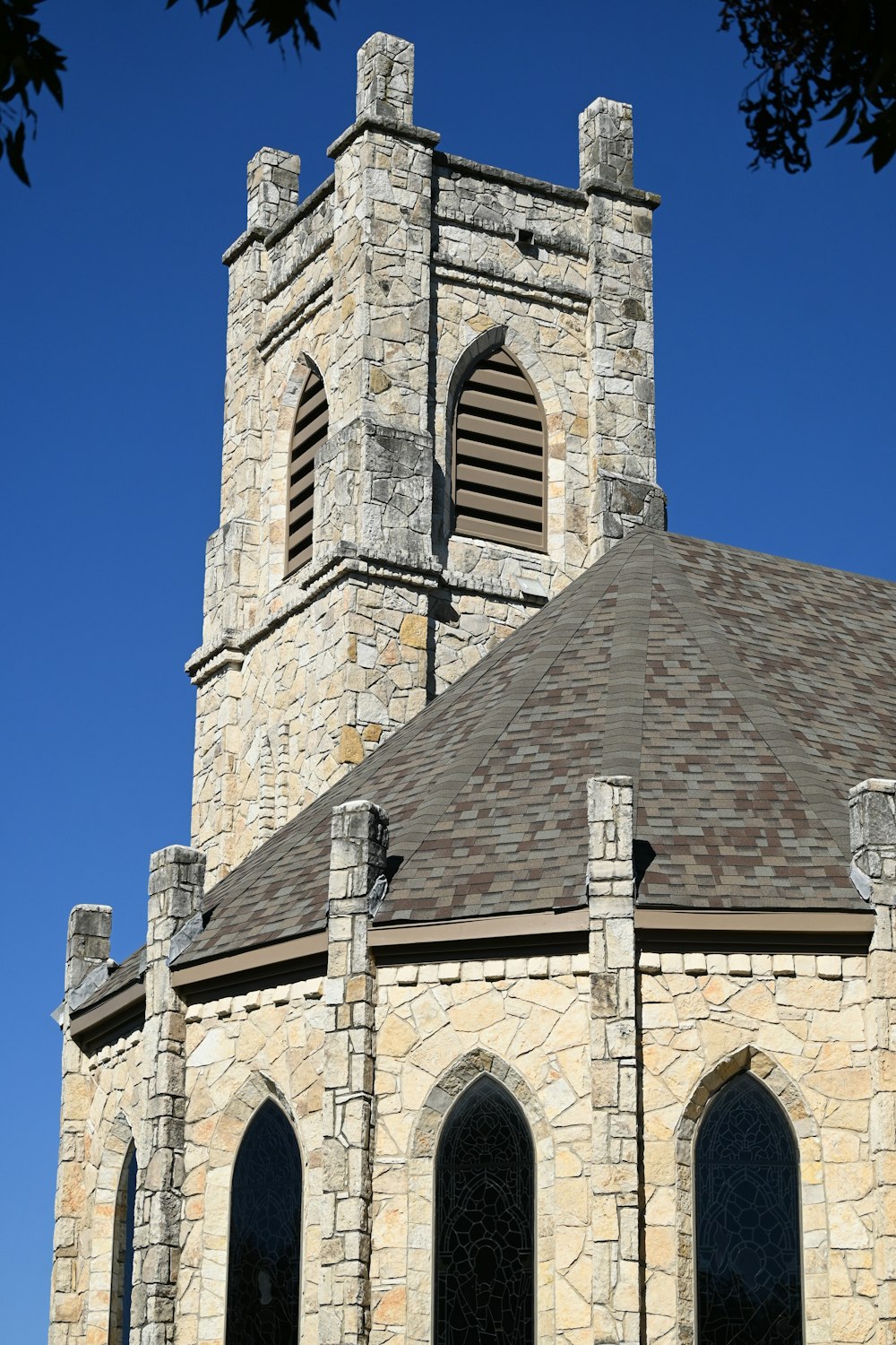 a large stone building with a clock tower