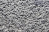 Close-up of pure white calcium carbonate powder texture.