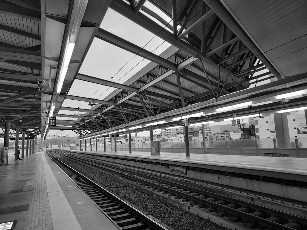 a black and white photo of a train station