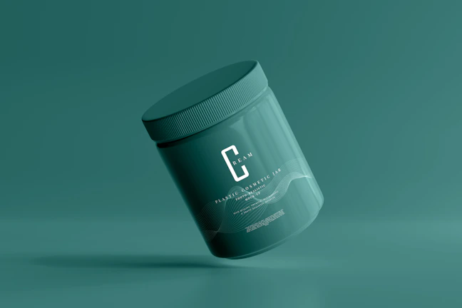 A green cosmetic jar with a minimalist design, featuring the letter 'C' prominently on its front. The jar appears to be floating against a solid green background, creating a sense of simplicity and elegance.