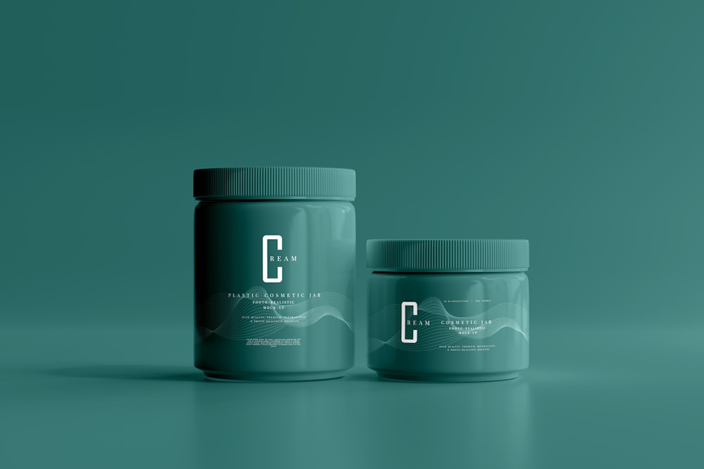 two jars of powder on a green background
