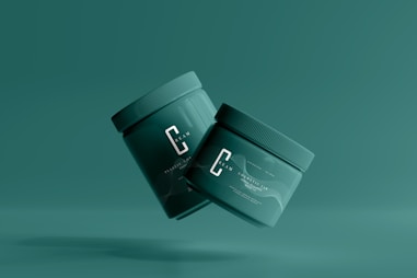 a green container with the letter c on it flying through the air