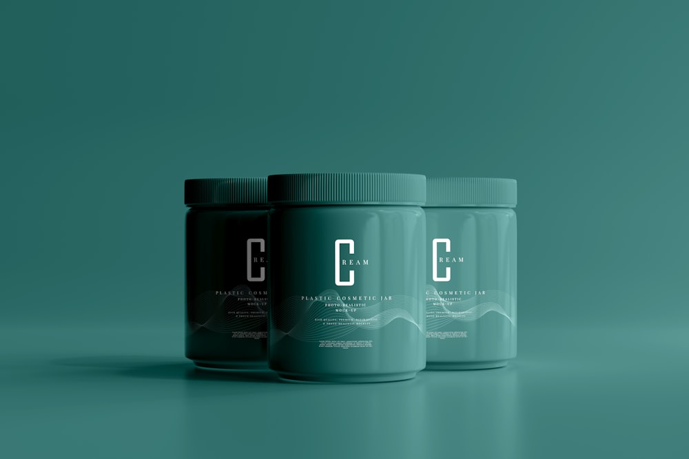 three jars of cb on a green background