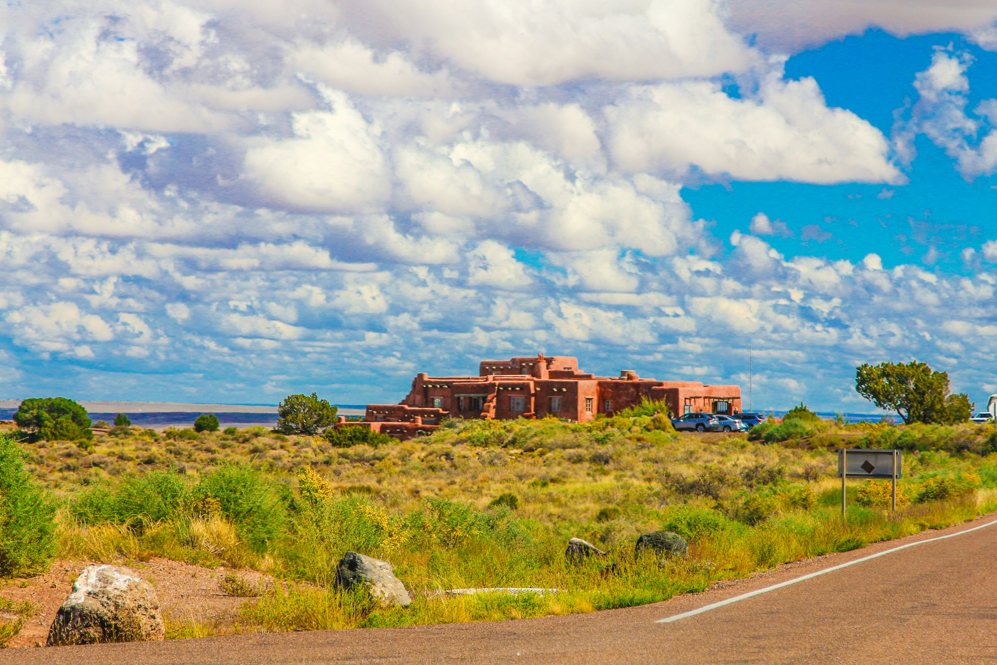 a large building sitting on the side of a road