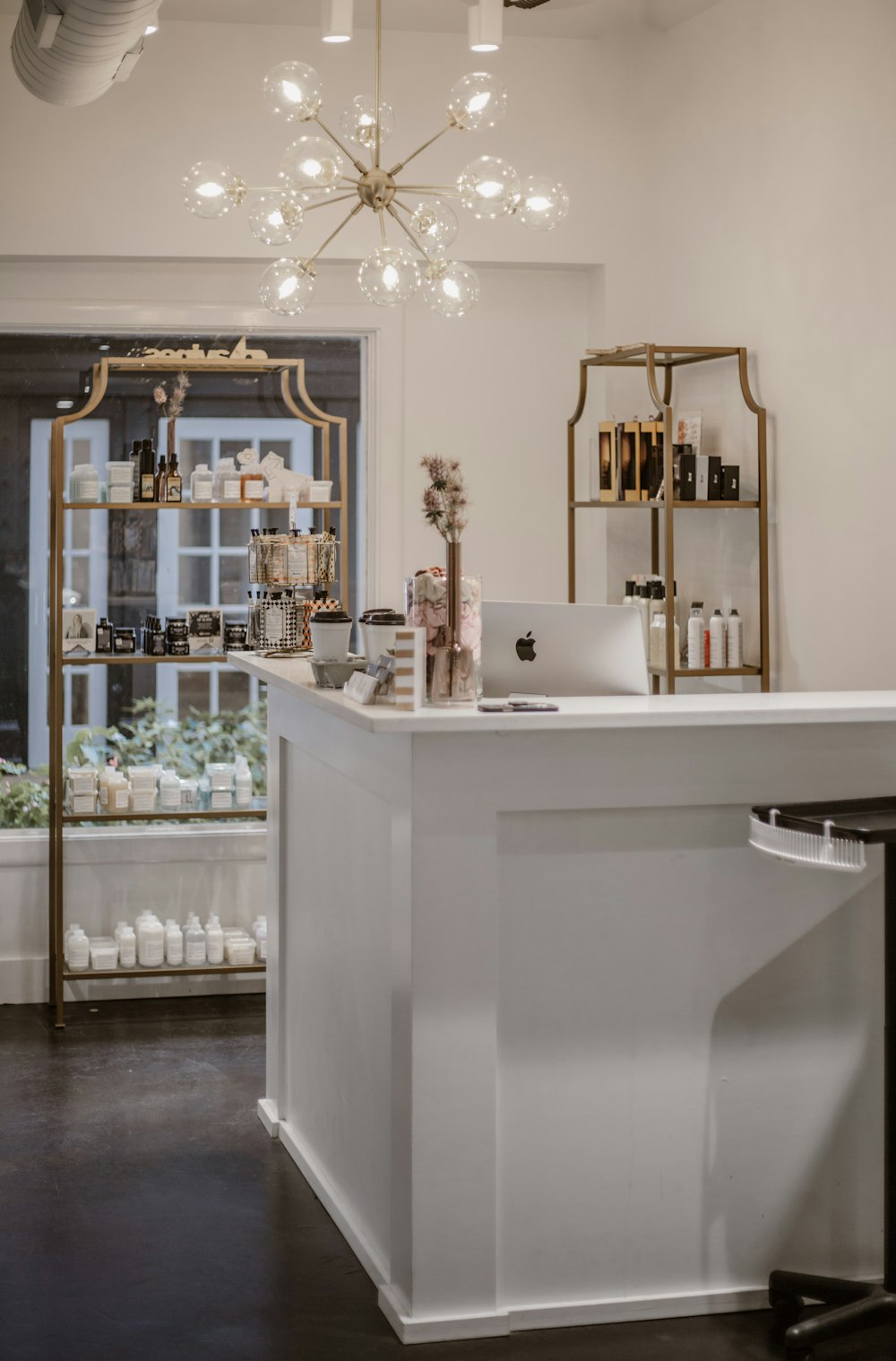 a white counter in a room with a chandelier