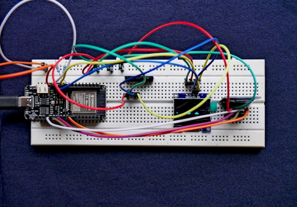 a white board with a bunch of wires attached to it