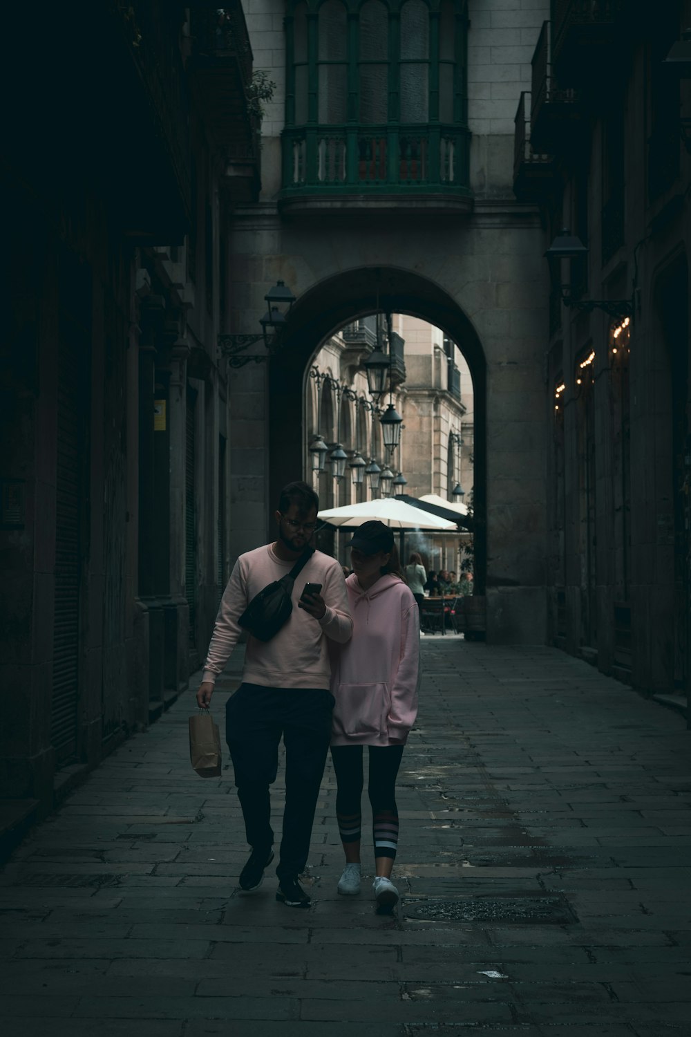 a man and a woman walking down a street