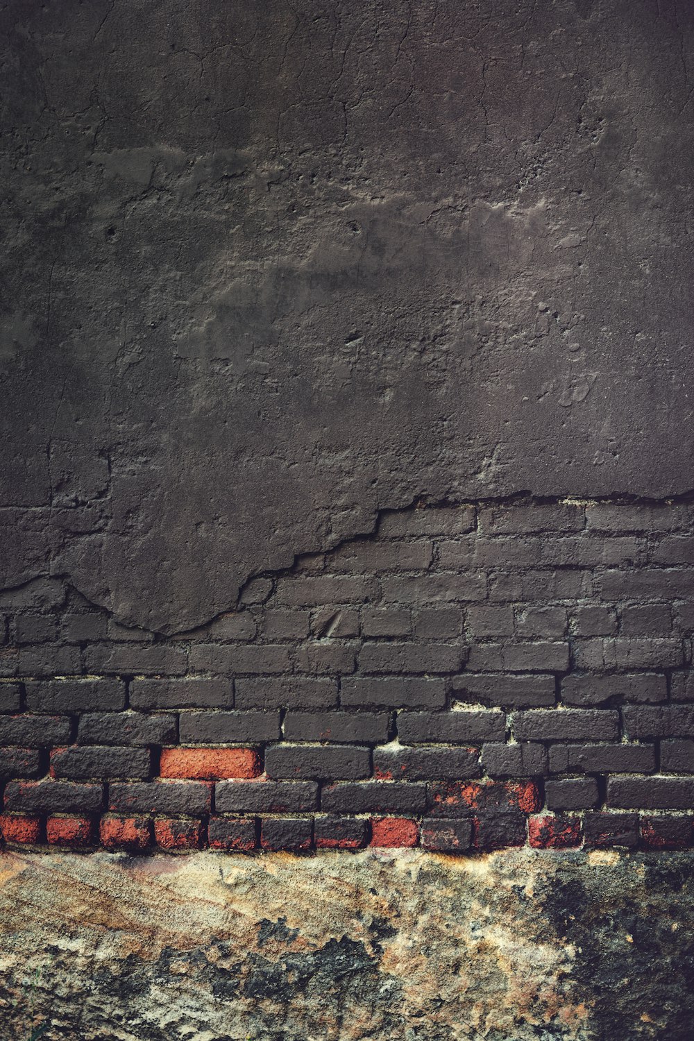 an old brick wall with a grungy surface