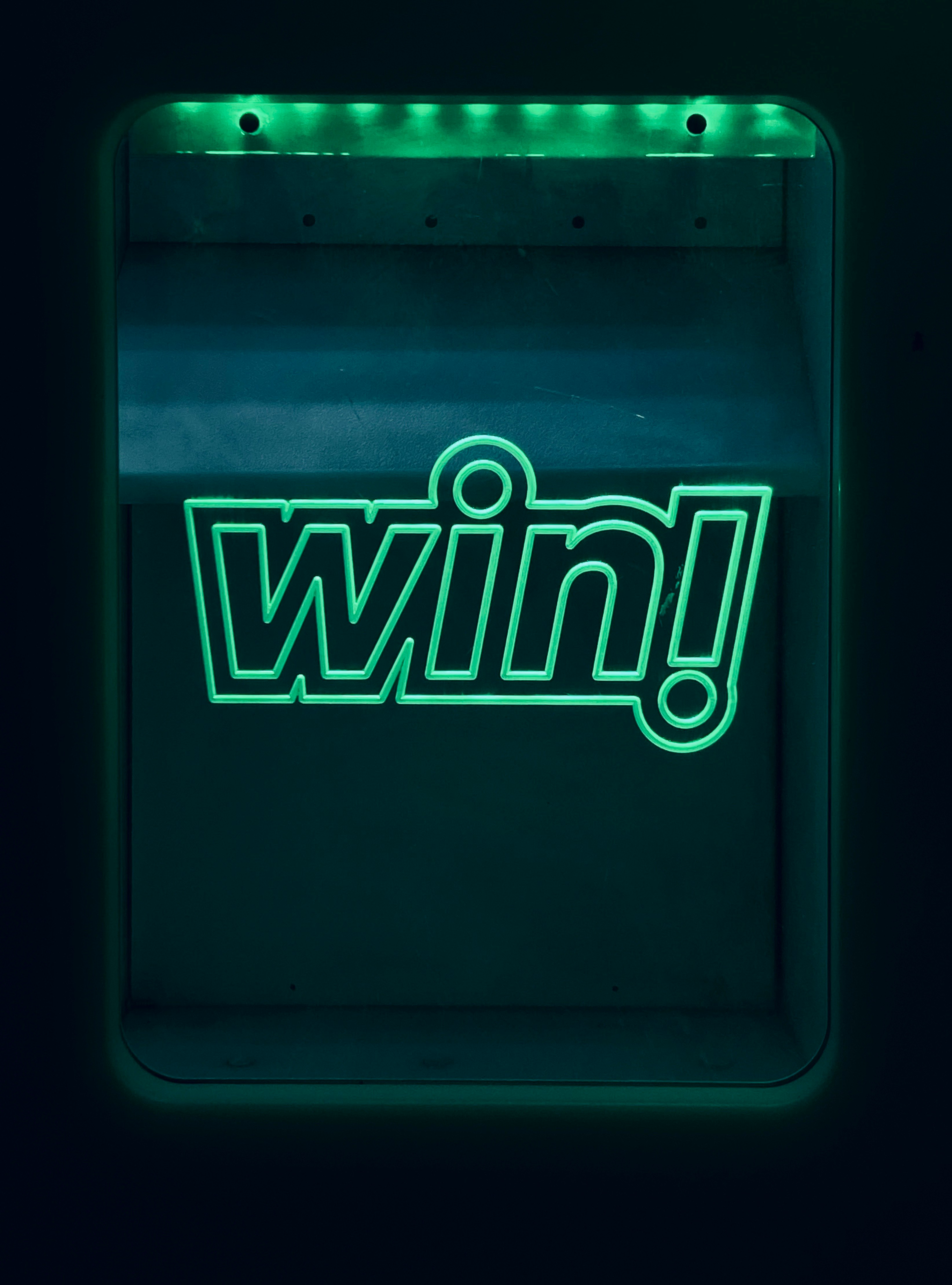 a neon sign with the word win on it