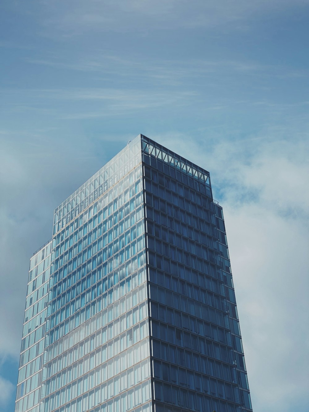 a very tall building with a sky background