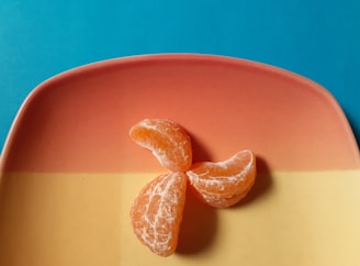 a peeled orange sitting on top of a plate