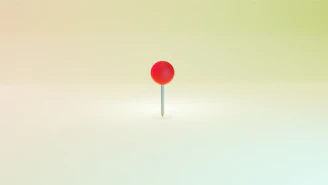 Minimalist icon of a location pin on a dark background.