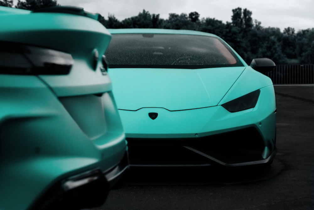 a blue sports car parked in a parking lot