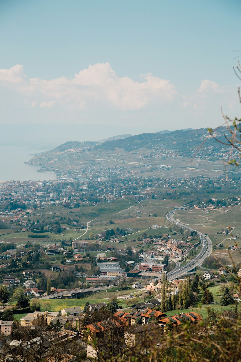 a scenic view of a city and a body of water