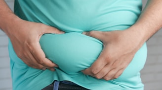 a man holding his stomach with his hands