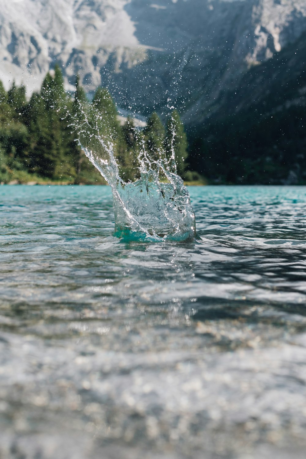 a splash of water in the middle of a river