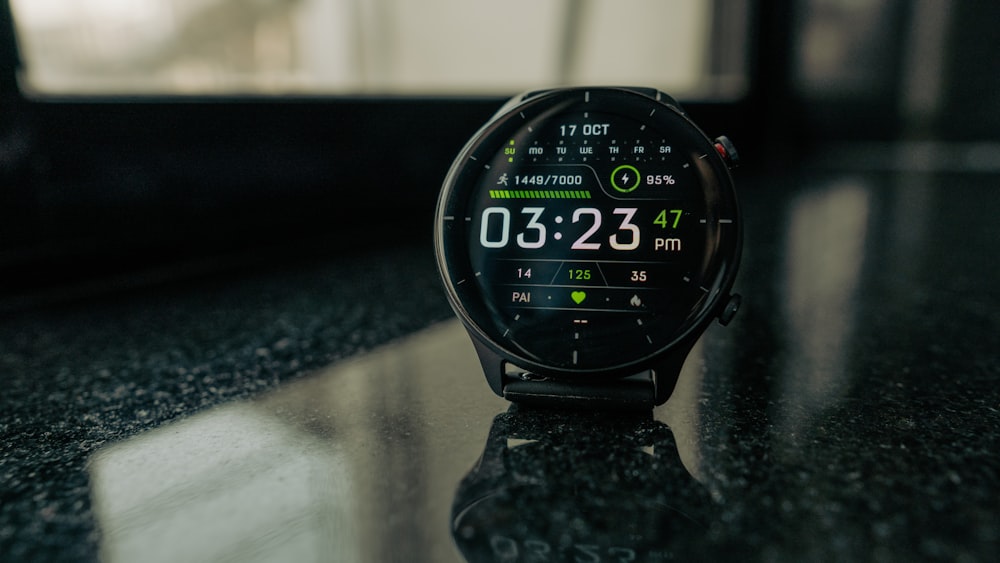 a close up of a smart watch on a table