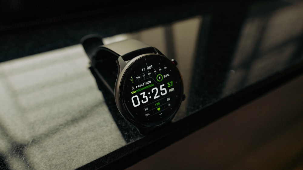 a close up of a smart watch on a table