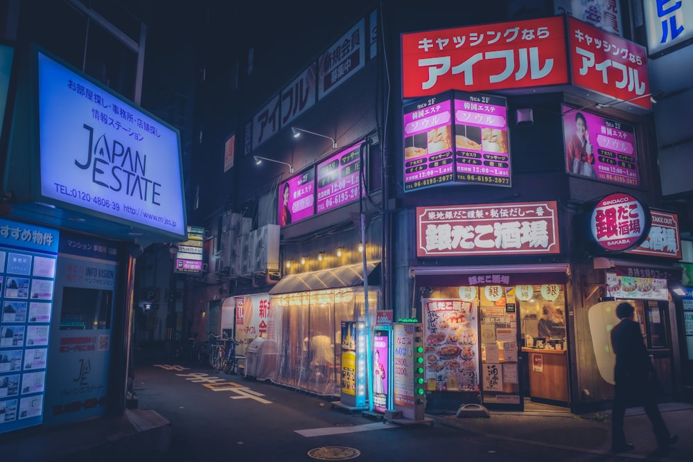 a city street filled with lots of neon signs