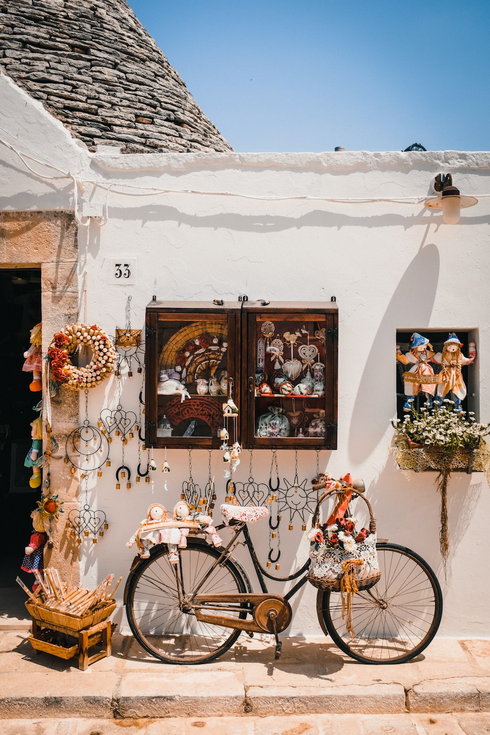 a bicycle parked in front of a white building