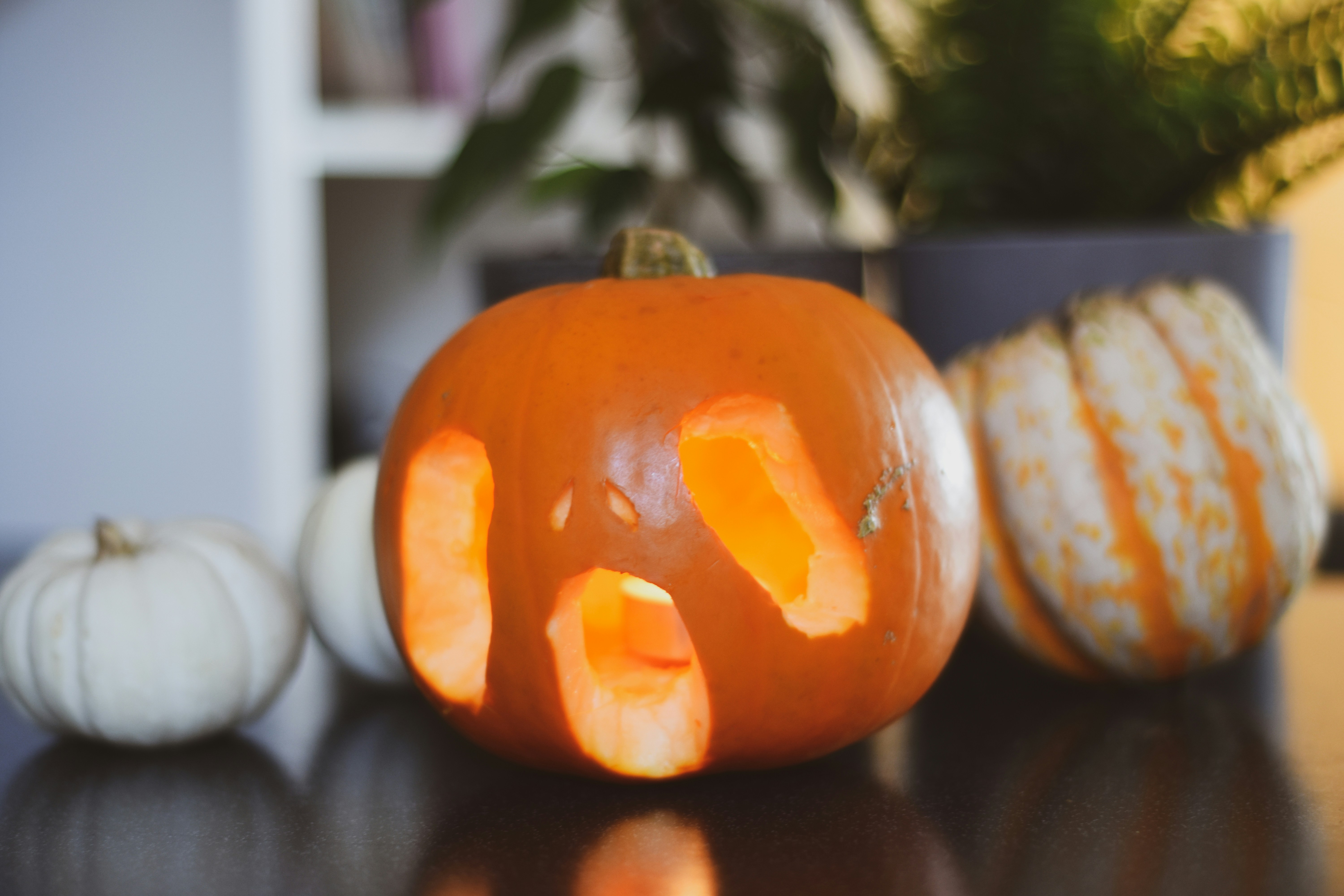 a carved pumpkin sitting on top of a table