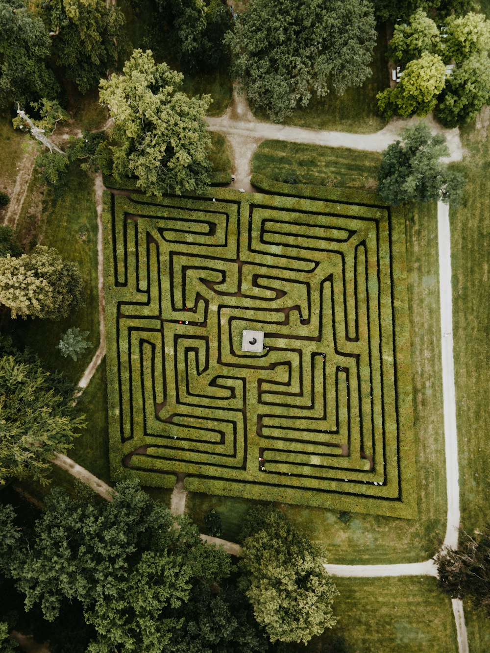 an aerial view of a maze in the middle of a field