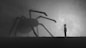 a person standing in front of a giant spider